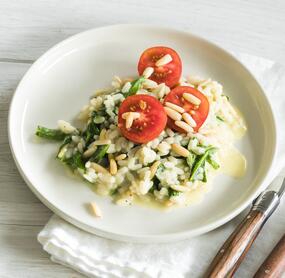 Risotto mit Rucola und Tomaten